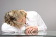 Senior woman sleeping on the table