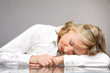 Pensioner sleeping on the table