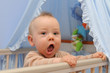 Happy infant in bed