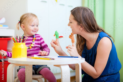Photo: Mother and daughter playing with finger toys Mother and daughter playing with finger toys