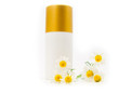 Jar with a cream and a branch of a chemist's camomile Jar with a cream and a branch of a chemist's camomile