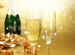 Champagne glasses on golden background