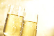 Champagne glasses on golden background