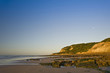 Beautiful view of beach at sunrise with rock details
