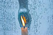 melted frost pattern on window glass and candle melted frost pattern on window glass and candle