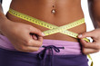 woman measure her waist belly by metre-stick woman measure her waist belly by metre-stick
