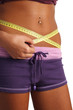 woman measure her waist belly by metre-stick woman measure her waist belly by metre-stick