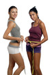 Two women measure waist belly by metre-stick Two women measure waist belly by metre-stick