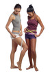 Two women measure waist belly by metre-stick Two women measure waist belly by metre-stick