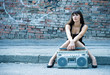 Woman with boom box on the street
