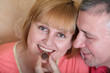 Husband gives his wife a candy Husband gives his wife a candy