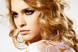 Woman model with shiny hair, sexy make-up and lace on shoulders