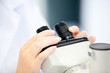 Close-up of a female scientist looking through a microscope Close-up of a female scientist looking through a microscope