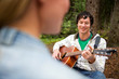 Man Playing Guitar for Woman Man Playing Guitar for Woman