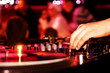 DJ playing vinyl on turntable