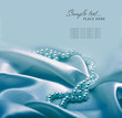Photo: Pearls a necklace on a silk fabric Pearls a necklace on a silk fabric