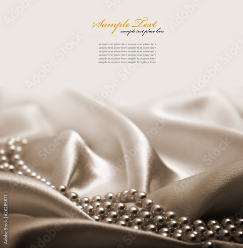 Photo: Pearls a necklace on a silk fabric Pearls a necklace on a silk fabric