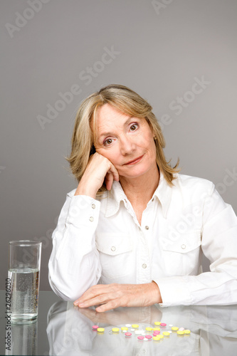 Photo: Elder woman drinking medicine Elder woman drinking medicine