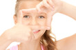 pretty girl creating a frame with fingers pretty girl creating a frame with fingers