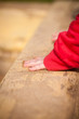 young adorable baby play with sand near sandbox in park young adorable baby play with sand near sandbox in park