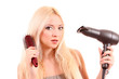 Beautiful young blonde woman brushing her long hair Beautiful young blonde woman brushing her long hair