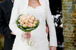 Photo: Bride and groom showing wedding bouquet Bride and groom showing wedding bouquet