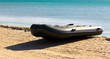 Inflatable boat on seacoast Inflatable boat on seacoast