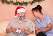 Photo: christmas holiday senior with carer or grandchild christmas holiday senior with carer or grandchild