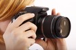 woman with single-lens reflex camera