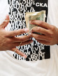Photo: man holding bundle of cash man holding bundle of cash