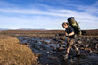 Hiker is crossing the river