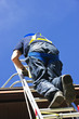 Photo: Construction worker climbing ladder Construction worker climbing ladder