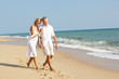 Senior Couple Enjoying Beach Holiday Senior Couple Enjoying Beach Holiday