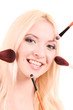 Beautiful young blonde woman with bright make-up and many brushe Beautiful young blonde woman with bright make-up and many brushe