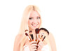 Beautiful young blonde woman with bright make-up and many brushe Beautiful young blonde woman with bright make-up and many brushe