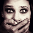 Scared woman victim of domestic torture and abuse