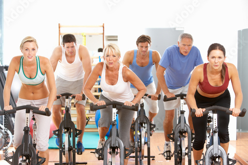 Photo: Group Of People In Spinning Class In Gym Group Of People In Spinning Class In Gym