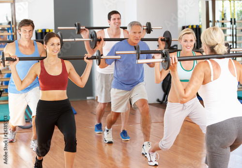 Photo: Group Of People Lifting Weights In Gym Group Of People Lifting Weights In Gym