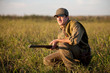 Hunter waiting sliently on the hunting field