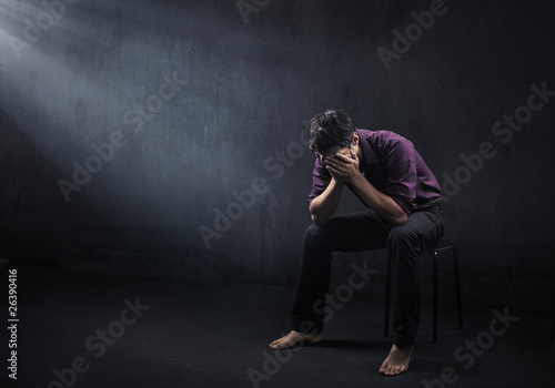 Photo: Sad man in a empty room Sad man in a empty room