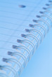 Spiral notebook in blue light