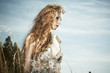 Portrait of the beautiful woman against the sky