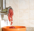 Meat grinder in action. Raw beef