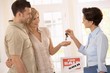 Estate agent handing over keys