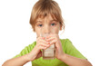 small girl in blouse with large eyes drinks tasty fresh milk