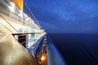 Images : big illuminated cruise ship riding in evening. wide angle.