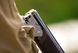 Hunter reloading its gun during a hunting party