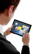 Photo: businessman holding a touchpad pc using little widget programms businessman holding a touchpad pc using little widget programms
