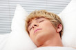 Man sleeping in his bed