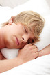 Man sleeping in his bed